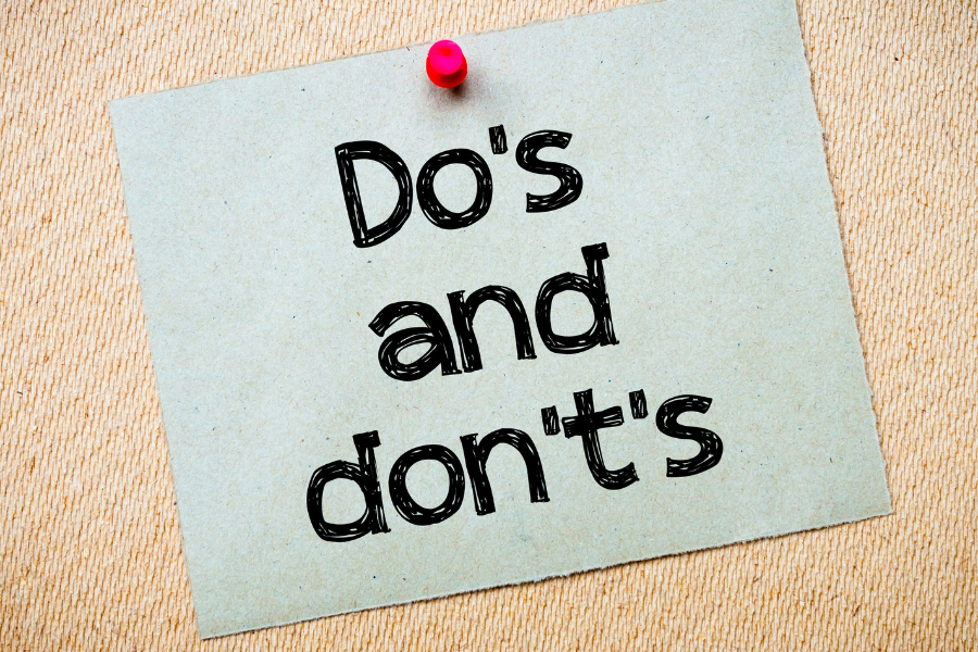 Do’s and Don’ts Message. Recycled paper note pinned on cork board.